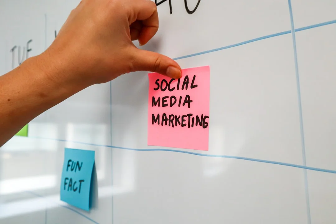 A close-up view of a brand strategy document on a desk surrounded by design artworks.